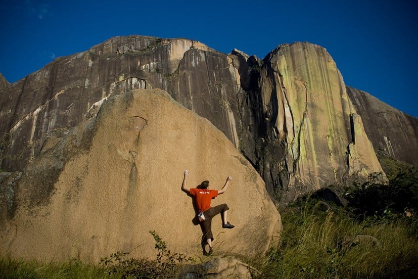 Jack Geldard on a V6 boulder beneath the tower cliff of Karambony - home of 'Tough Enough'  © UKC Articles