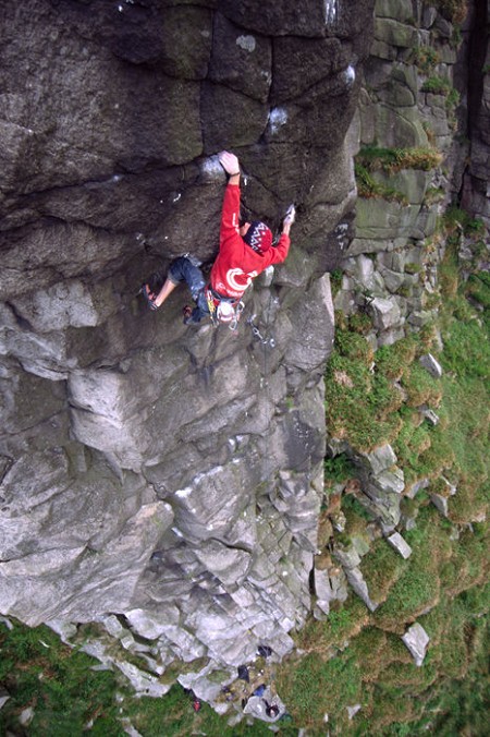 Ricky Bell making the 4th ascent of the amazing looking Divided Years E9, 6c, Buzzards Roost.  © Craig Hiller - from the new Mournes Guidebook