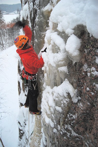 Toby ice climbing in the Alpinist Jacket and Salopettes  © Toby Archer