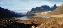 Baffin Island with view down pass towards Pangnirtung. Mt Asgard and turner glacier to the right of photo.
