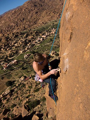 James Pearson cleaning a new route on the granite outcrops of Tafroute, Morocco  © James Pearson Collection
