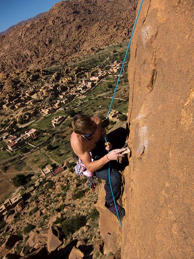 James Pearson cleaning a new route on the granite outcrops of Tafroute, Morocco  © James Pearson Collection