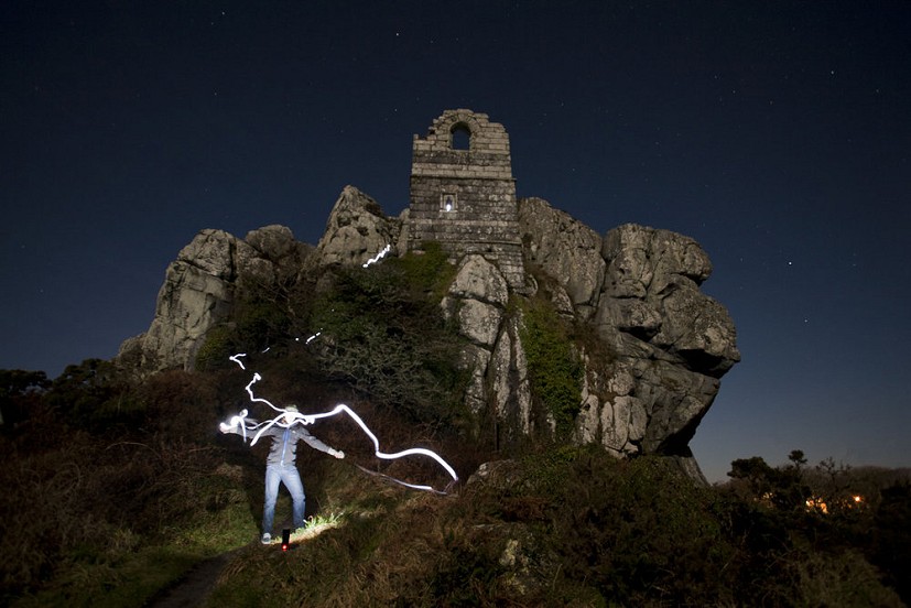 Self portrait at Roche Rock by moon and torchlight  © Tom Last