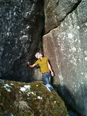 Me checking out a foot-less treverse at Manaton Rocks.  © tomwheeler