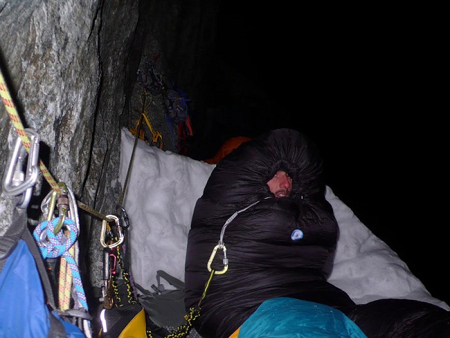 Remy enduring a very cold first bivouac  © Sébastien Ratel