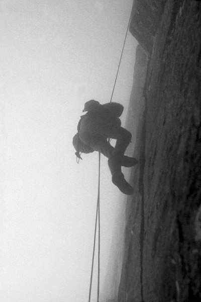 John Amatt descending the Great Wall, engulfed by the storm during the retreat  © Tony Howard