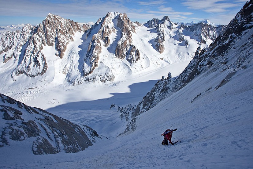High up on the Couturier Couloir, skis on the back  © Jon Griffith