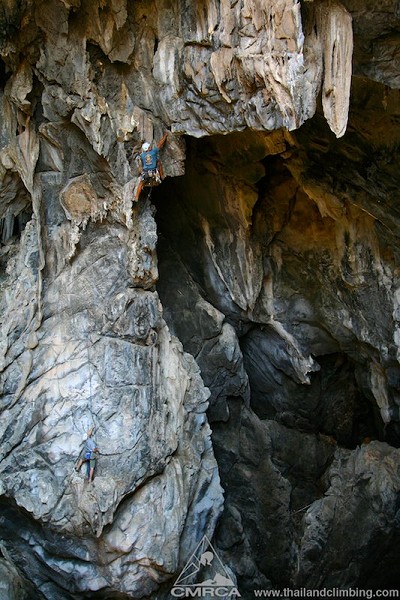 Climbing on tufas and stalactites through the roof of a cave 70+ meters off the cave floor in Thailand.   © TC Changed