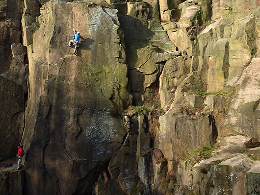 Suspended above the pool on the tricky crux of Suspense E2 5c Lawrencefield.  © andybirtwistle