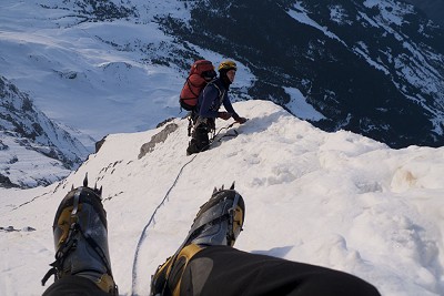 Jack Geldard's Spantiks poking over the edge of Death Bivvy, Eiger North Face.  © Jack Geldard