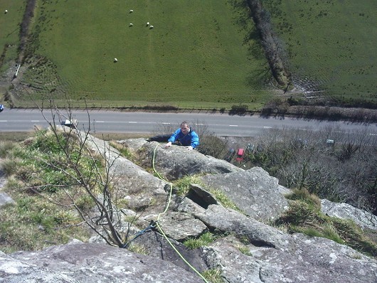 Frank topping out on "One Step in the Clouds", Tremadog. Really lovely climbing.  © dionhughes