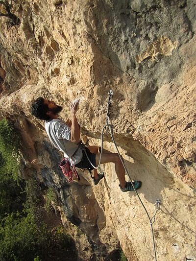 Fahad leading Puzzled Monkey (6c) - a 30m rite of passage for local climbers with ambition  © John Arran