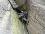 Wayne about to start the roof part of cleft wing super direct at Stanage