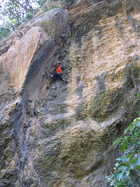 Jens on the tufa-fest that is Blame God (6b+). The arête to the left is unclimbed but possible at 8b or more  © John Arran