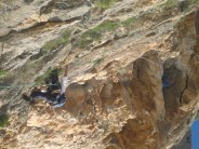 Belaying from the shade of the cave