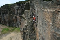 Craig Bailey crimping hard on Dragon's Route (E3 5c*), Hobson Moor Quarry.