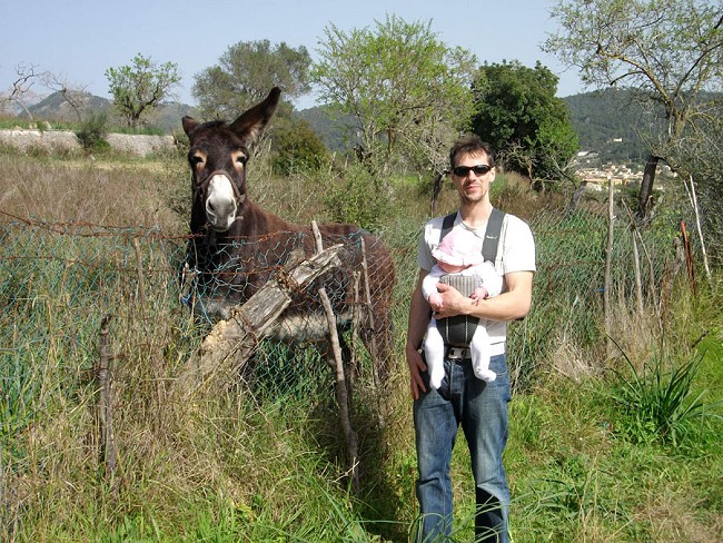Chris Savage on holiday with his baby daughter Ciara (and a friendly mule!)  © Chris Savage Collection