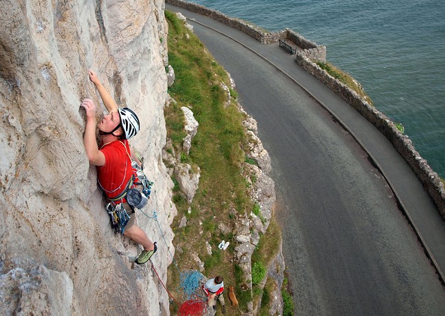 Chris Carroll climbing above the road at the Ormes © chriscarroll  © chriscarroll