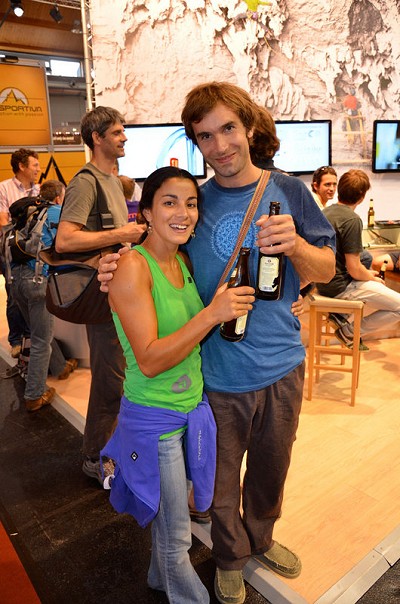 Daila Ojeda and Chris Sharma enjoying a beer on Saturday evening on the Petzl stand at the Germany Trade show  © Mick Ryan UKC/UKH