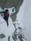 Stevie Elder on the easy start of the Arête des Cosmiques with the Abri Simmonds Hut just before the start of the climb