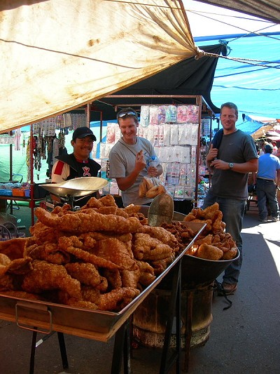 Pigging out at a stall entirely devoted to pork scratchings in Tlachichuca. Perfect hill food.  © Dan Bailey