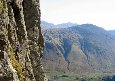 Climber on Inertia (HVS 5a), Gimmer Crag, Lake District. The big corner is The Crack (VS 4c)  © Jamie Moss