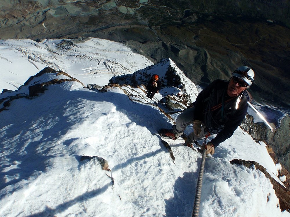 An Italian guide leads his client up the last of the fixed ropes on the Matterhorn  © Chris Ellyatt