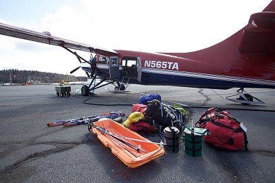 Packing the plane for take off  © Jon Griffith / Alpine Exposures