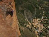 Climbers high above Riglos village on the Murciana route<br>© ali k