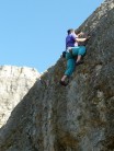 Pete Bowen on Six good biceps F4 Blacknor South. The Petzl Ultimate cap keeping the sun off.