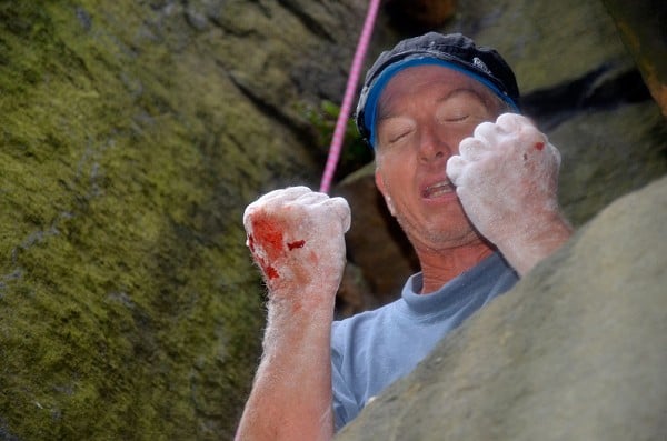 Russ Walling in pain at the top of Forked Lightning Crack, Heptonstall Quarry  © Mick Ryan