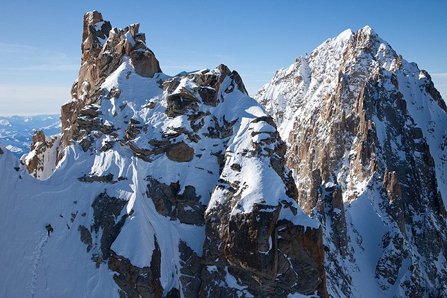 Ueli Steck about to top out on the Ginat- Aiguille Verte in the background  © Jon Griffith