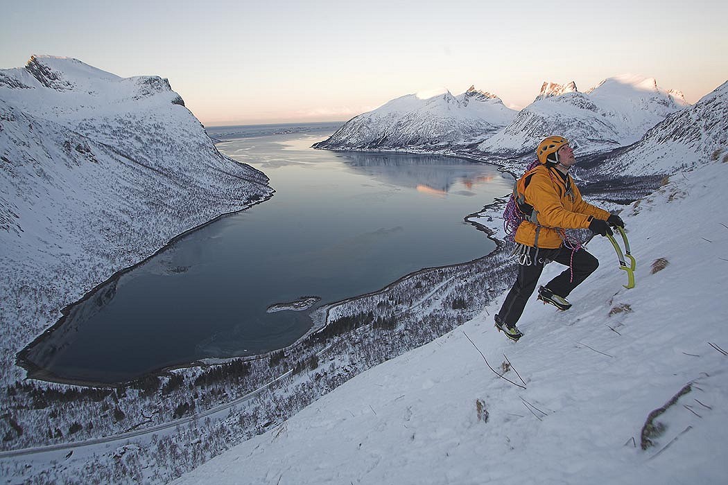 Klemen Premrl aproaching to Hesten South face, the mountain above Bergfjorden, Senja island, Norway.   © Urban Golob
