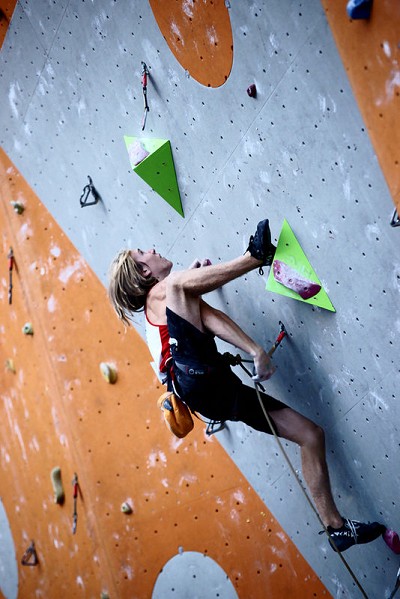 Top British competition climber Ed Hamer demonstrates a heel-hook  © Will Carroll