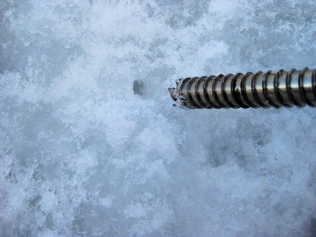 A re-bored screw is an ice screw placed in an existing hole. Faster, easier, but is it as strong?  © George McEwan Collection