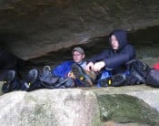 Escaping the rain in Robin Hoods Cave, Stanage