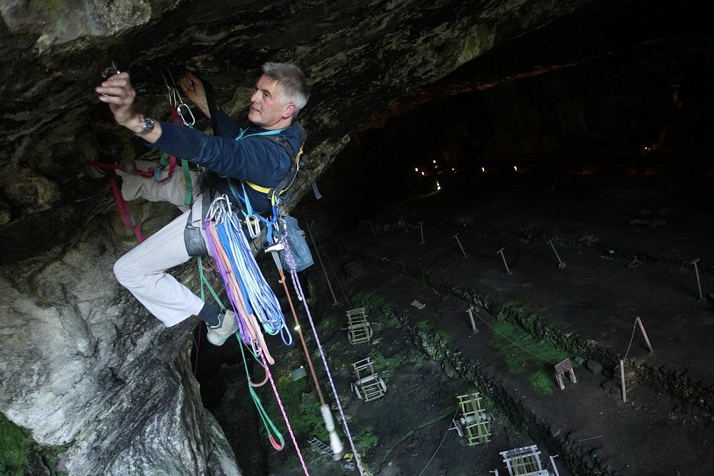 Aid Climbing in the Peak District - Dave Williams in action in Peak Cavern  © Robbie Shoane