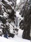 Inverlael Gully in lean conditions with ice over chockstone melting