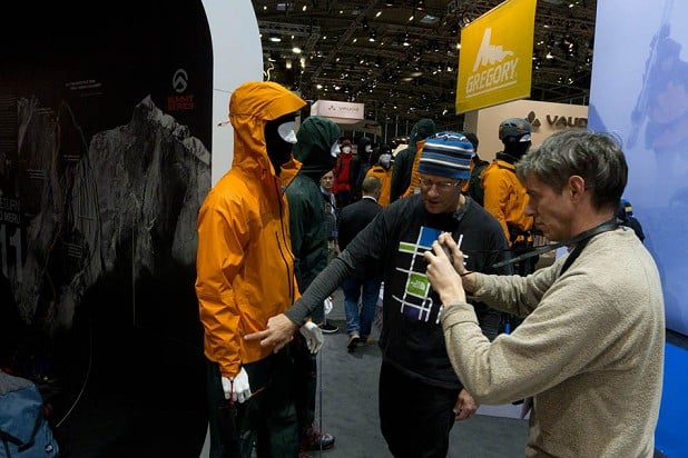 Alan James filming Conrad Anker on The North Face stand - ISPO 2012  © Mark Glaister