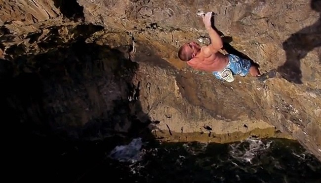 Neil Gresham on the high second crux section of Hydrotherapy - 8a+ - Pembroke  © Liam Cook