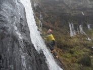 Ian Durham enjoying creaky ice on the upper pitch of the Water Slides, Ratten Clough, Lancashire.