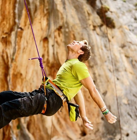 Robbie Phillips slumped on the rope after failing on a route in Kalymnos  © Will Carroll