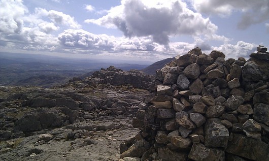 From the main summit cairn of Pike O Blisco, looking south to the other cairn, Windermere and the Coniston fells.  © dangerdave