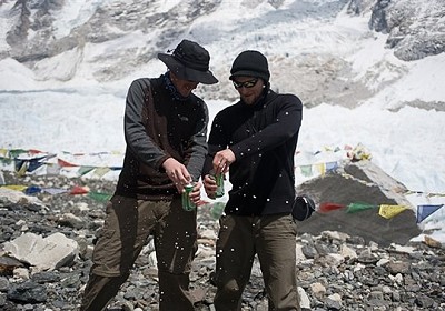 Kenton Cool and cameraman Keith Partridge celebrating the '8848 Likes' with a beer at Everest base camp  © BMC Collection
