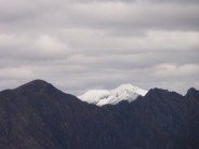 A dry Aonach Eagach with snowy Na Gruagaichean and Binnein Mor behind on 19.5.12