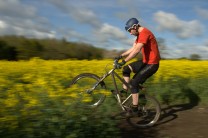 nick power wheeling (on a 4 foot wide track which cut) through the rapeseed (field)