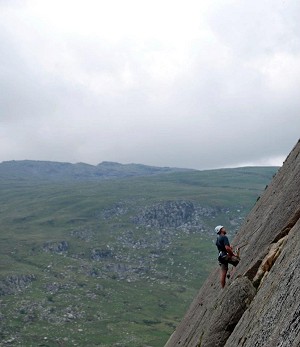 Photo taken of me at the belay point of second pitch of Central Slab Route (VD) at Tryfan Fach (Little Tryfan).  © Tamarin Gibbs