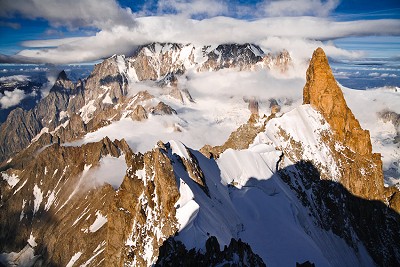 Arête de Rochefort with tiny climbers leading to Dent du Géant. In the background Mt. Blanc.  © Ulrik Hasemann