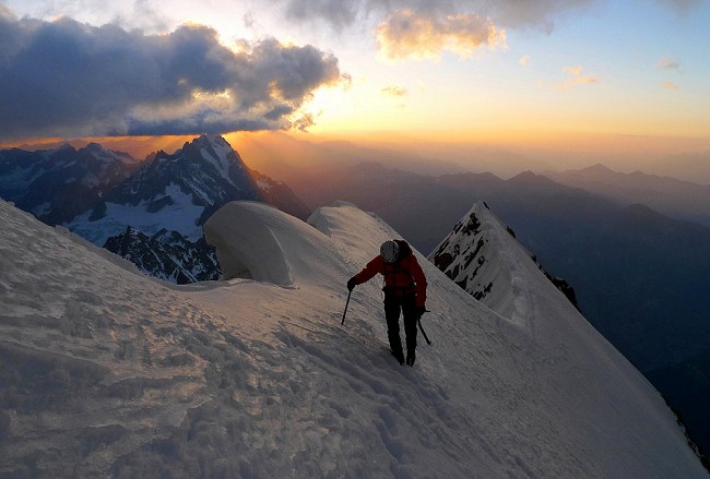 Sunrise on the Peuterey Ridge, after climbing Divine Providence. A long way still to go.  © Luka Lindic