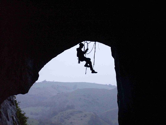 Lanky Paddy preparing to lower off the chain at the end of Kyrie Eleison, Thors Cave (A1).  © LankyPaddy